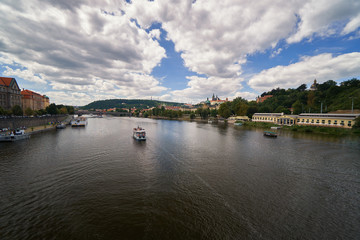 Fototapeta na wymiar Vltava river with ships, skyline Czech republic medievil historical landmark