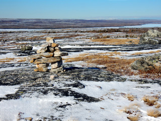 Inuksuk statue on the top of a mountain where the radar is in Kuujjuaq