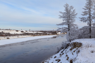 Beautiful winter landscape, frost on the branches of trees, the first snow,