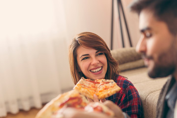 Couple eating pizza for lunch