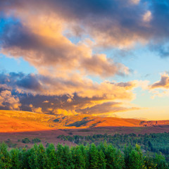 Beautiful sunset landscape scenery of hills and forest at Cargorms National Park