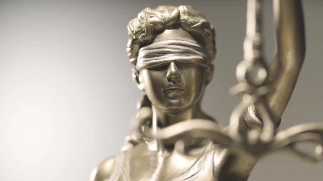 4k Lady Justice zoom in close up dolly shot - law concept shallow depth of field