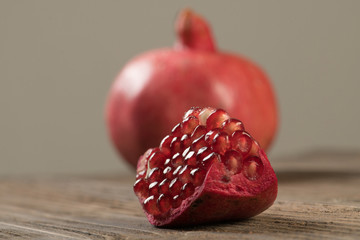Broken piece of garnet with whole garnet on the background