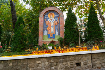 Bucharest, Romania - November 04, 2018: Candles lit at Radu Voda Monastery dedicated to Saint Nectarios of Aegina and The Holy Trinity situated in Bucharest, Romania.