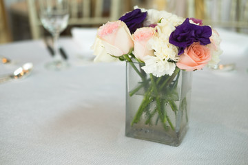 Flower table decorations for wedding dinner.