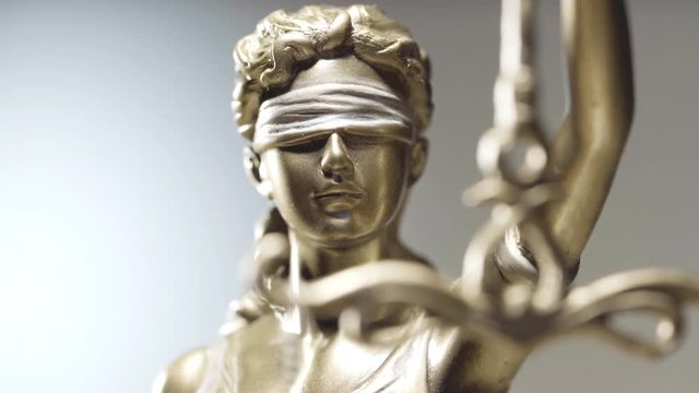 4k Lady Justice zoom in close up dolly shot - law concept shallow depth of field