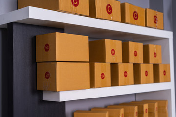 Parcels on shelf ready for shipment to client in the home office