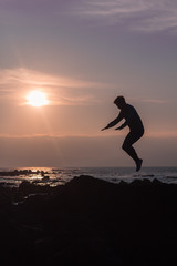 Model jumping in a sunset, lifestyle
