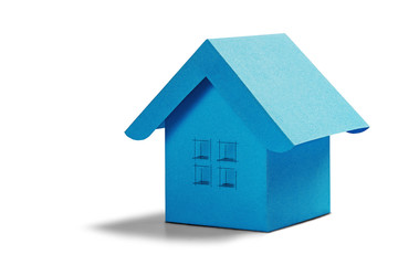 Estate concept, toy paper house with windows on isolated white background with shadow. Idea for real estate concept, personal property and family house.