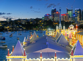 SYDNEY - AGUST 2018: Sydney Luna Park and skyline, aerial view at night