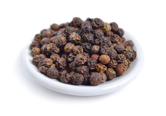 Close up of papper grains isolated on white background