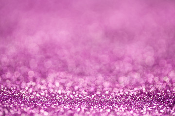 Purple glitter sparkles. Blurry background