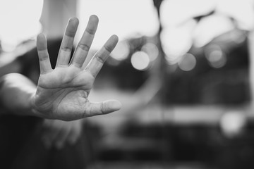 Stop harassment and abuse in relationship, a serious young asian woman standing with outstretched...