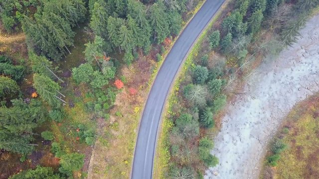 Bird's-eye view of the mountain road that runs along the Prut River. Carpathians. Ukraine. Top view
