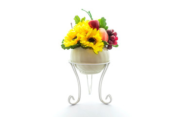 Artificial plastic flowers and fruits isolated on white background.