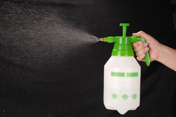 Pressure sprayer bottle in hand