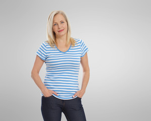 Friendly smiling middle-aged woman isolated on grey background