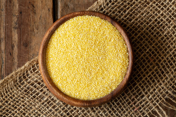 Corn meal in wood bowl.