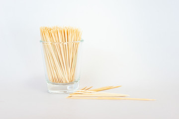 toothpick isolated, toothpick from bamboo in a glass on white background