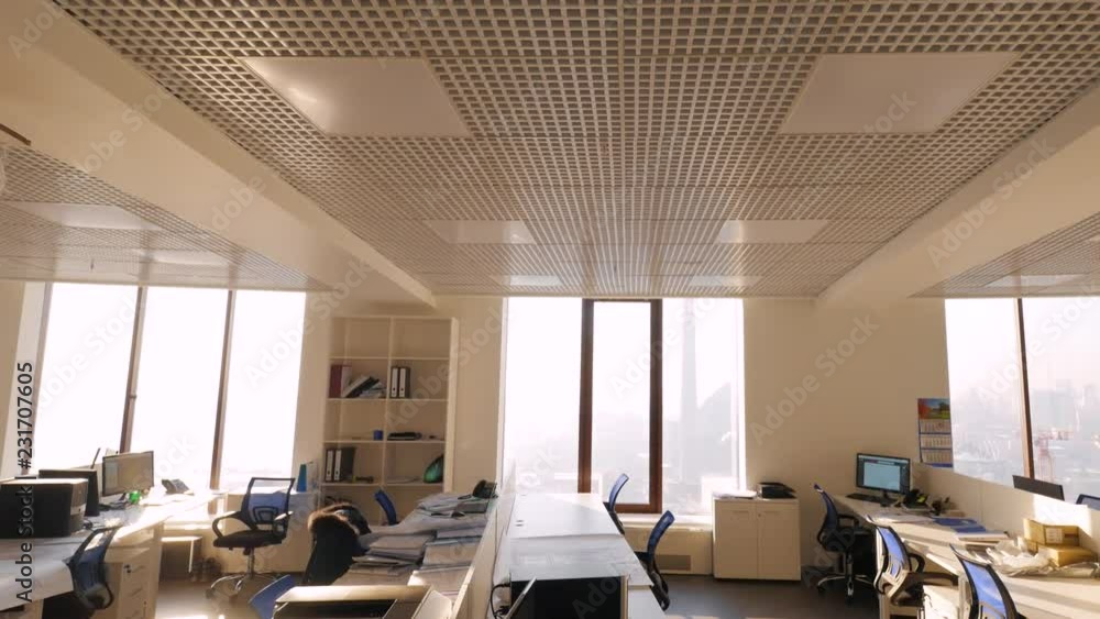 Poster large view of call center outside working hours. modern empty office with open plan and large window