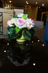 Beautiful of flower pot on the effective top of wooden  table