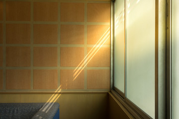 The light of sun shines through the long window