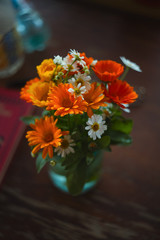 A bouquet of flowers is in a vase closeup.
