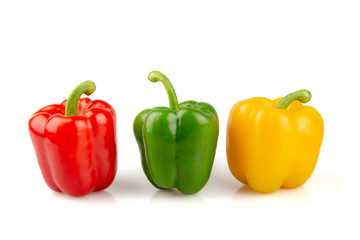 Three different colored of sweet bell peppers (capsicum) isolated on white background.