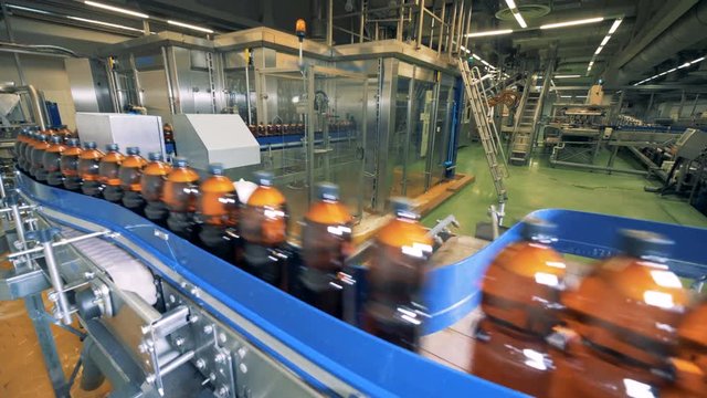 Brewery conveyor working in a factory facility. 4K.
