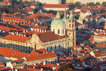 Fototapeta na wymiar Prague - The roofs of Mala Strana with the St. Nicholas church.