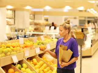 Woman buying fruits at the market