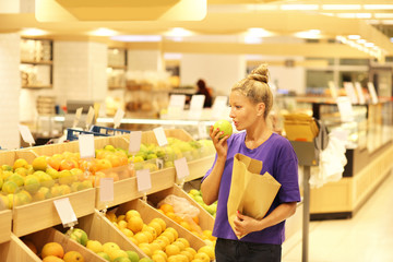 Woman buying fruits at the market