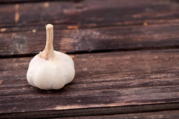 garlic on a dark wooden background