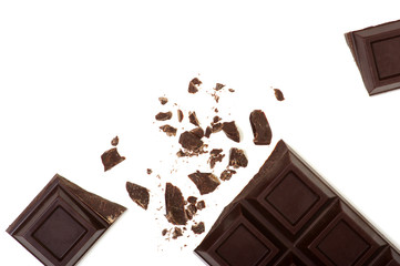 Broken chocolate bar isolated on white