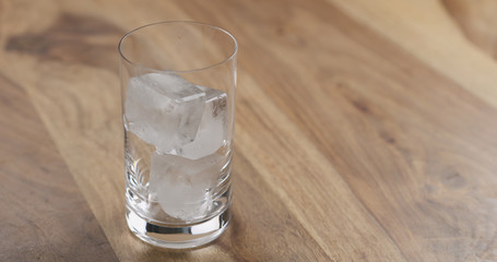 ice in glass on wood table