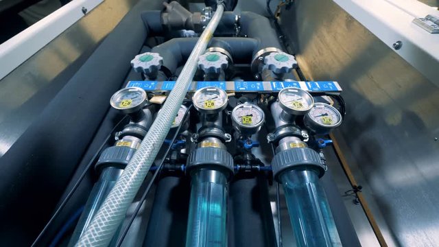 Modern water purification equipment. Valves, gauges at a water quality control panel.