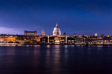 Fototapeta na wymiar St Pauls Cathedral River Thames reflections on London city skyline at night