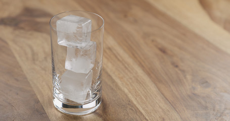 ice in glass on wood table