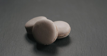 beige macarons on slate board