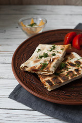 Roasted on the grill, crisp pita with graceful cold boiled pork, juicy tomatoes, cheese, sauce and herbs.