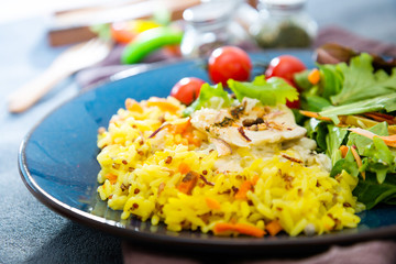 Cooked rice with vegetables, cod and lemon sauce