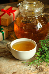 tea in a transparent teapot on the table (herbal tea is brewed). top view.