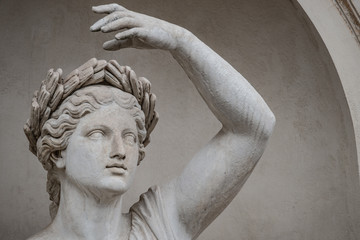Statue of sensual Roman renaissance era woman in circlet of bay leaves, Potsdam, Germany, details,...