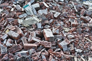 Pile of bricks debris at a building demolition site.