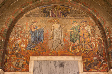 LONDON, GREAT BRITAIN - SEPTEMBER 17, 2017: The mosaic of Jesus Christ in Westminster cathedral with the symbolic wine and bread designed by Clayton & Bell (begin of 20. cent.).