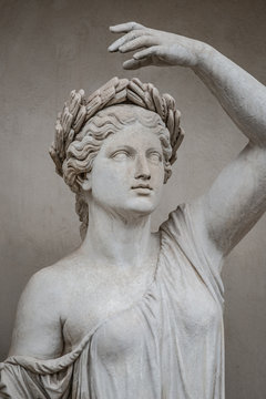 Statue of sensual Roman renaissance era woman in circlet of bay leaves, Potsdam, Germany, details, closeup