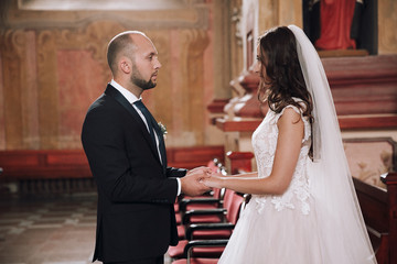 Wedding photo in the Church.Beautiful young couple
