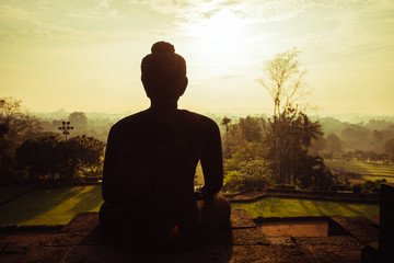 Meditating Buddha in the morning, Borobudur Temple