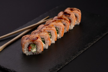 Japanese cold roll with salmon on black background