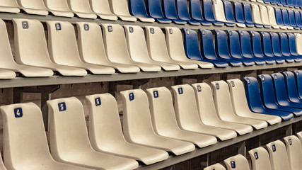 Empty white and blue seats in the stadium